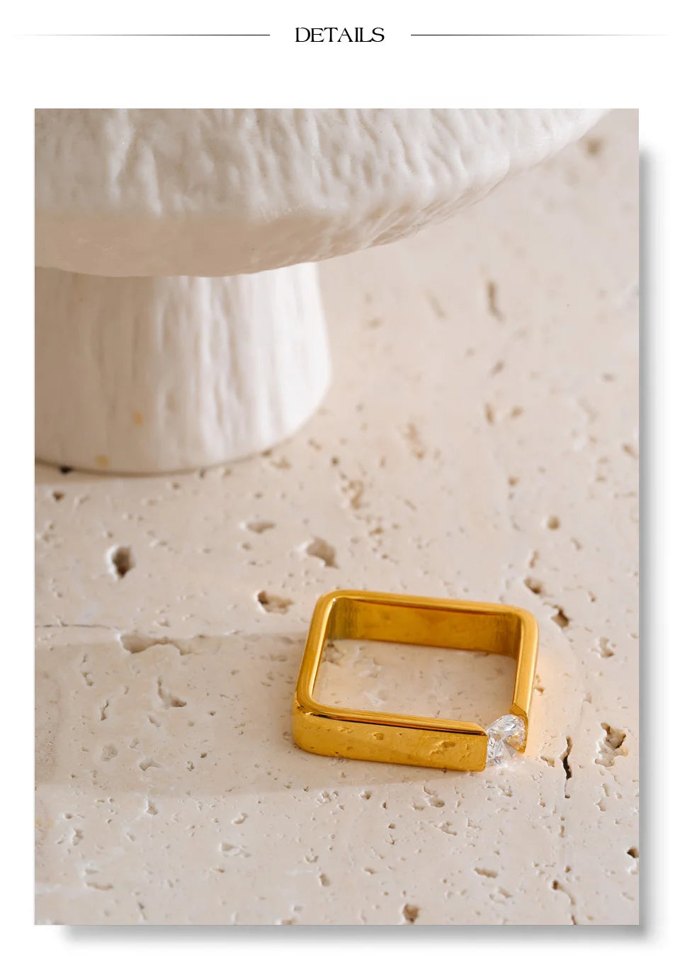 Cubic zirconia minimalist geometric ring in 18K gold-plated stainless steel with cubic zirconia.