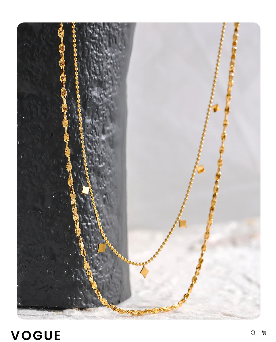 Geometric chain layered necklace in gold-plated stainless steel.
