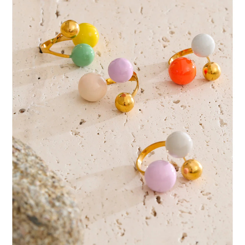 Enamel multi-color geometric ring in 18K gold-plated stainless steel with enamel.