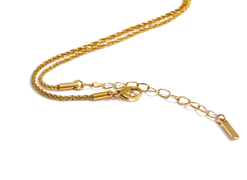 Cubic zirconia geometric chain necklace in gold-plated stainless steel with cubic zirconia.