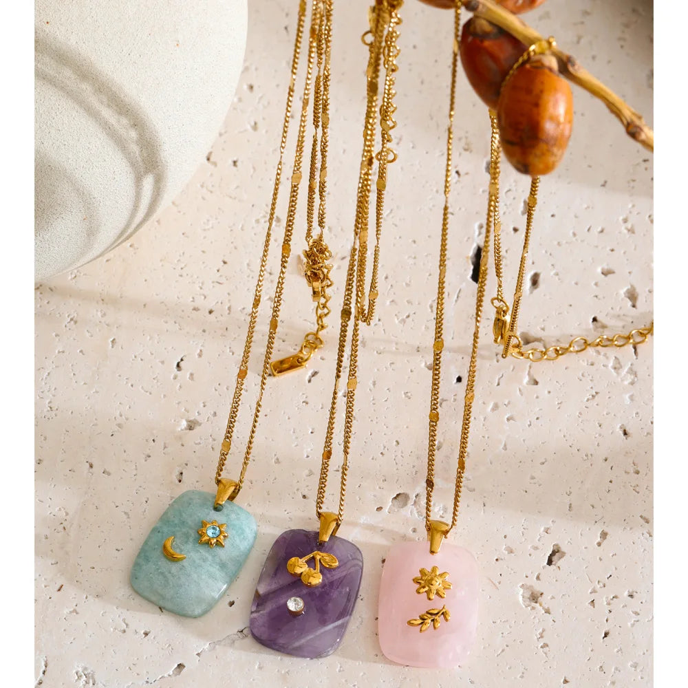 Gold-plated stainless steel necklace with natural stone pendants in shades of blue, pink, and purple.