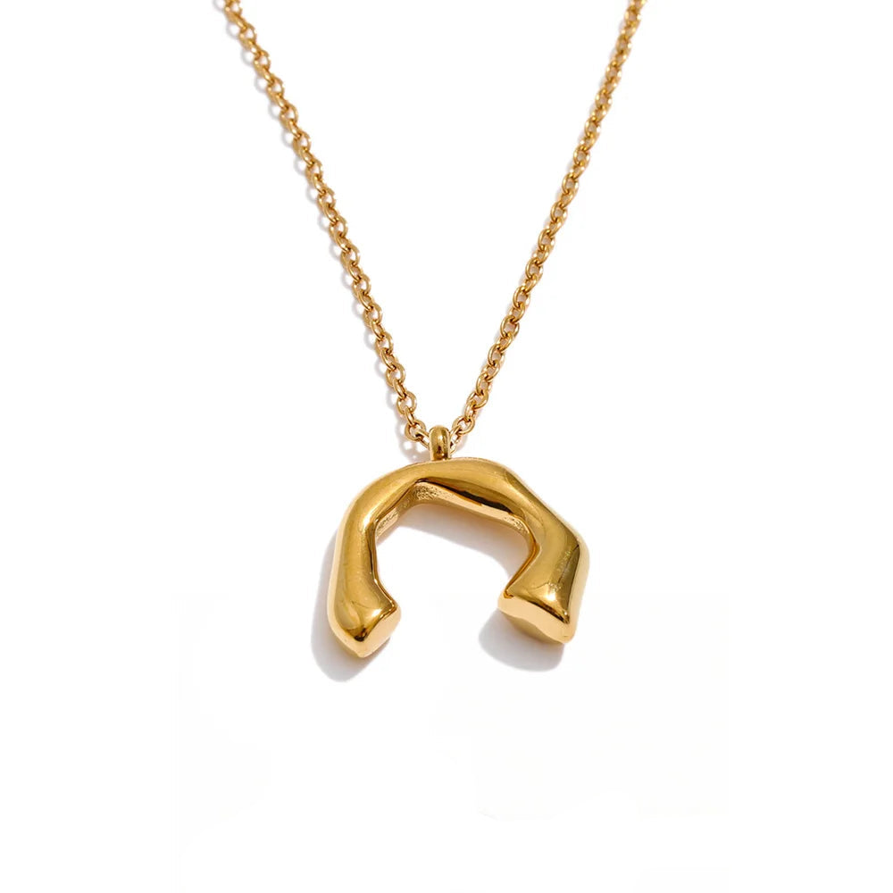Gold-plated stainless steel necklace featuring a unique horse shoe pendant.