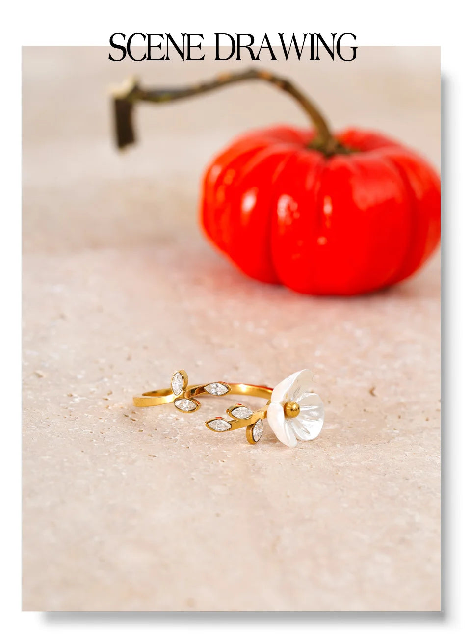Cubic zirconia resin flower ring in 18K gold-plated stainless steel with cubic zirconia and resin.