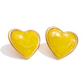 Resin acrylic heart earrings in gold-plated stainless steel with resin and acrylic.