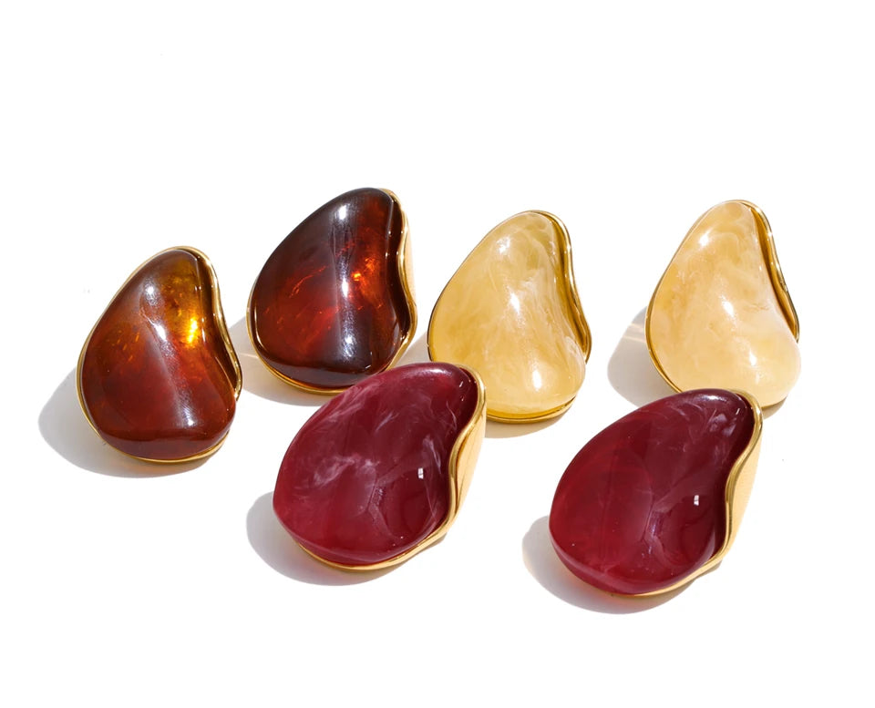 Red resin acrylic earrings in gold-plated stainless steel with resin and acrylic.