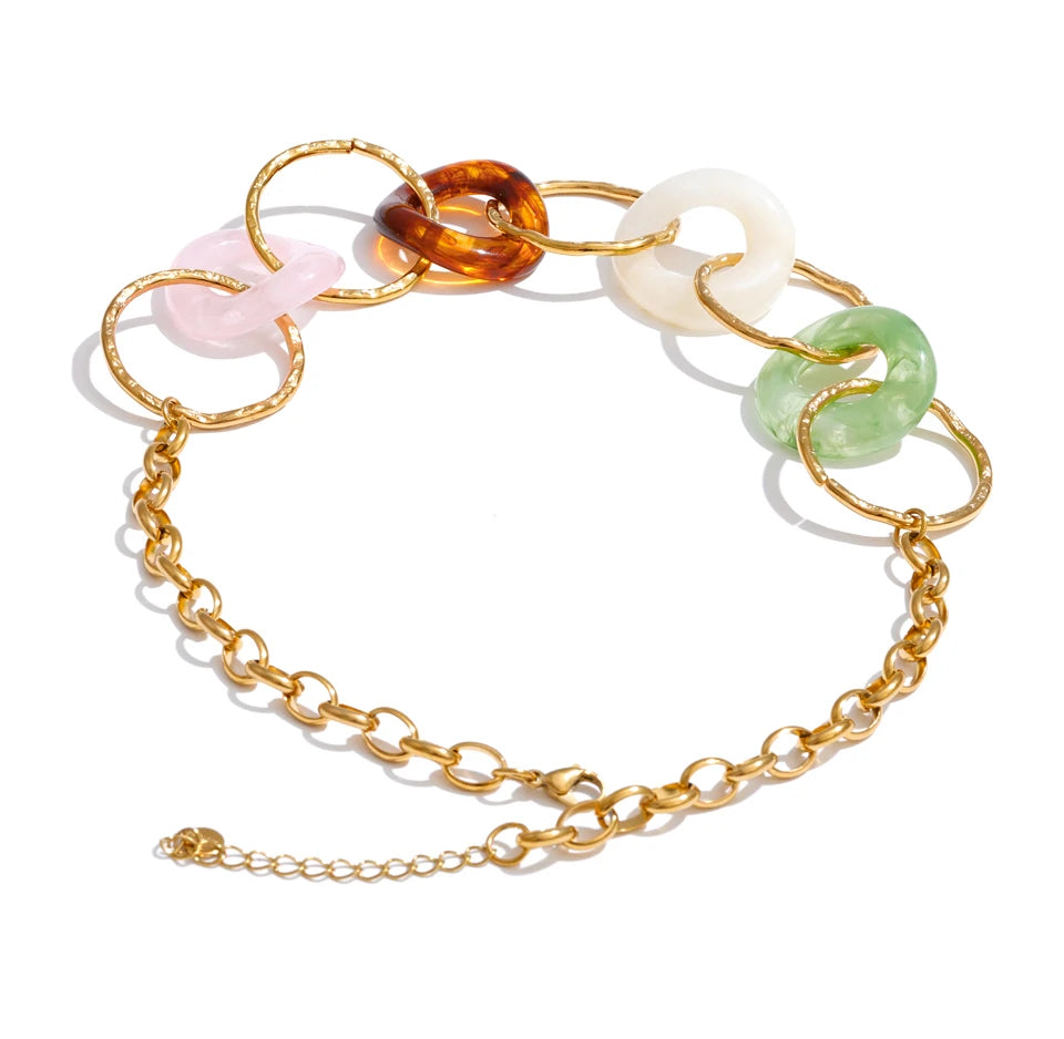 Resin acrylic geometric necklace in gold-plated stainless steel with resin and acrylic.