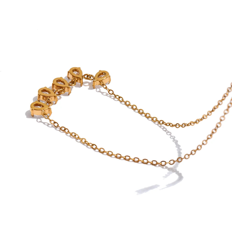 Cubic zirconia geometric necklace in gold-plated stainless steel with cubic zirconia.