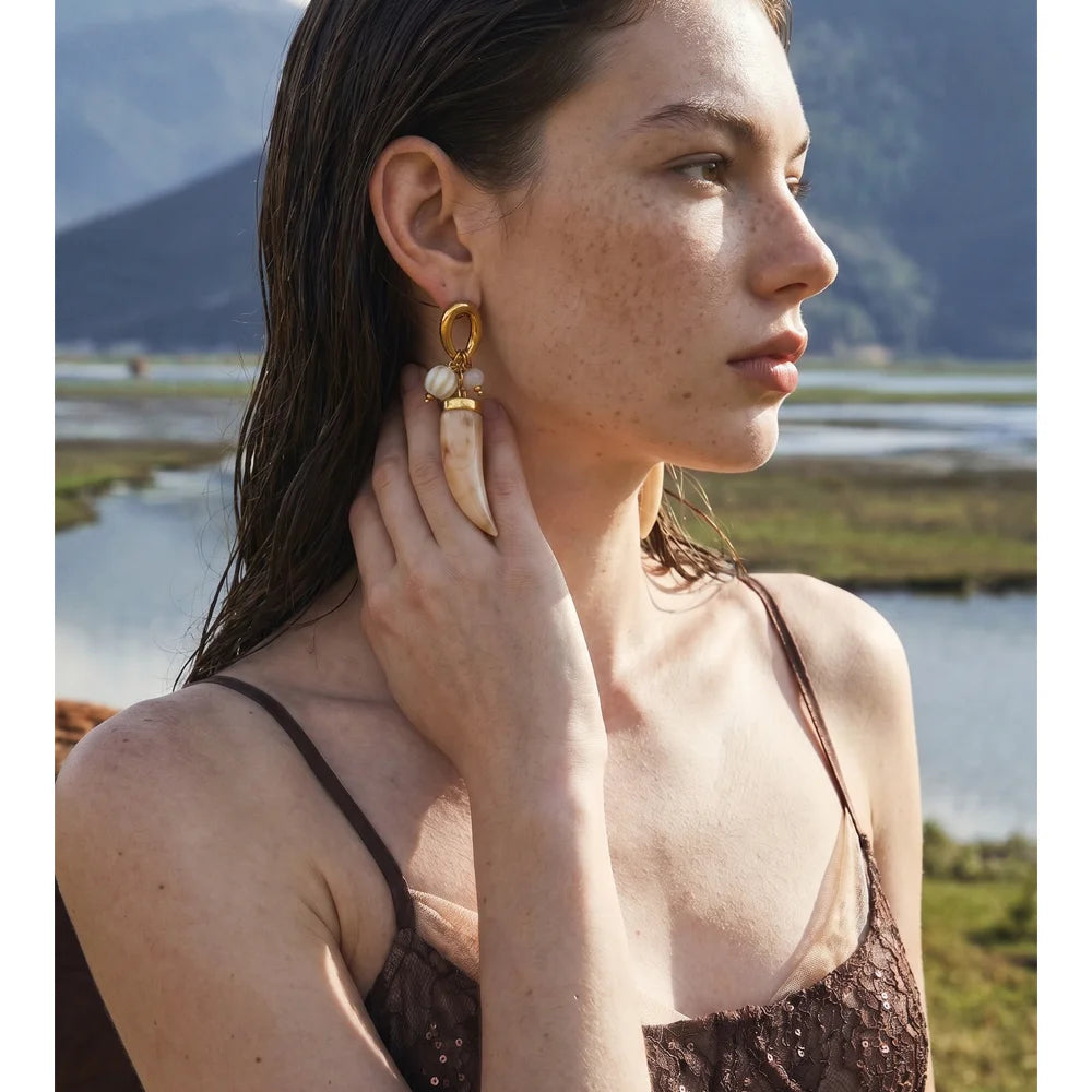 Resin acrylic geometric earrings in gold-plated stainless steel with resin and acrylic.