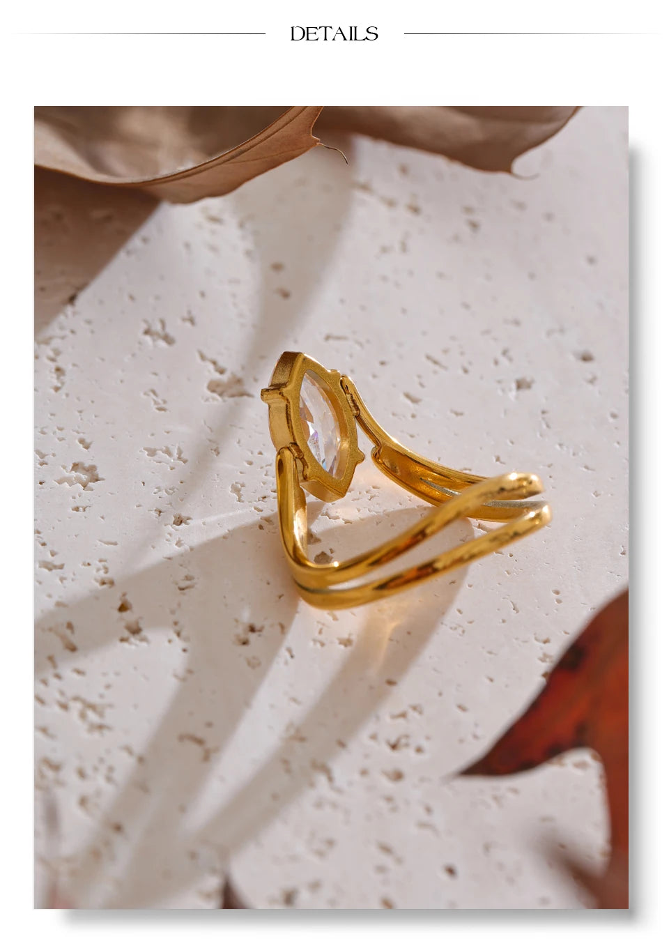 Cubic zirconia geometric ring in 18K gold-plated stainless steel with cubic zirconia.