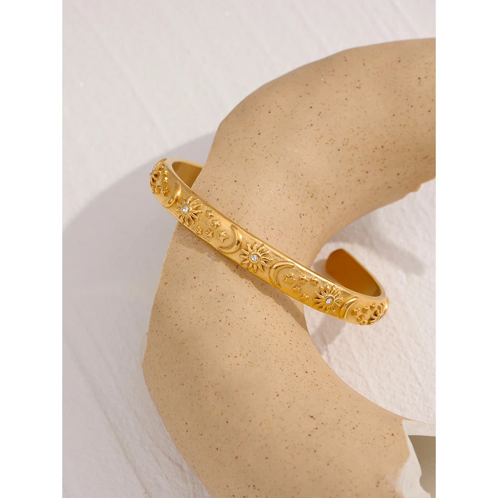 Star moon sun bracelet in gold-plated stainless steel.