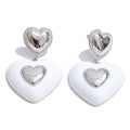 White enamel heart earrings in gold-plated stainless steel with enamel.