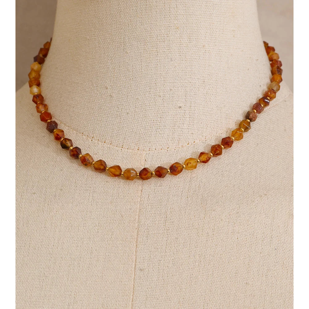 Natural stone beaded multi-color necklace in gold-plated stainless steel with natural stone.