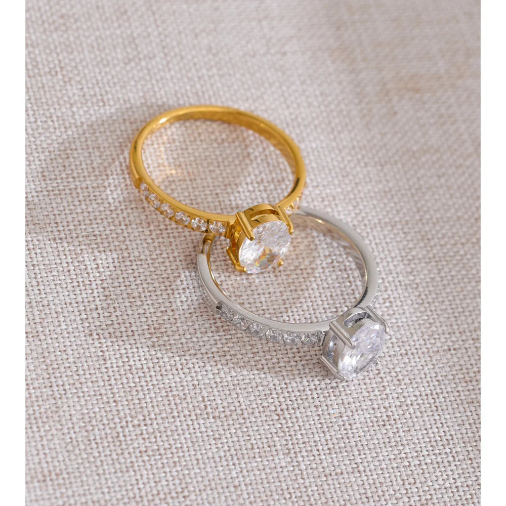 Cubic zirconia geometric ring in 18K gold-plated stainless steel with cubic zirconia.