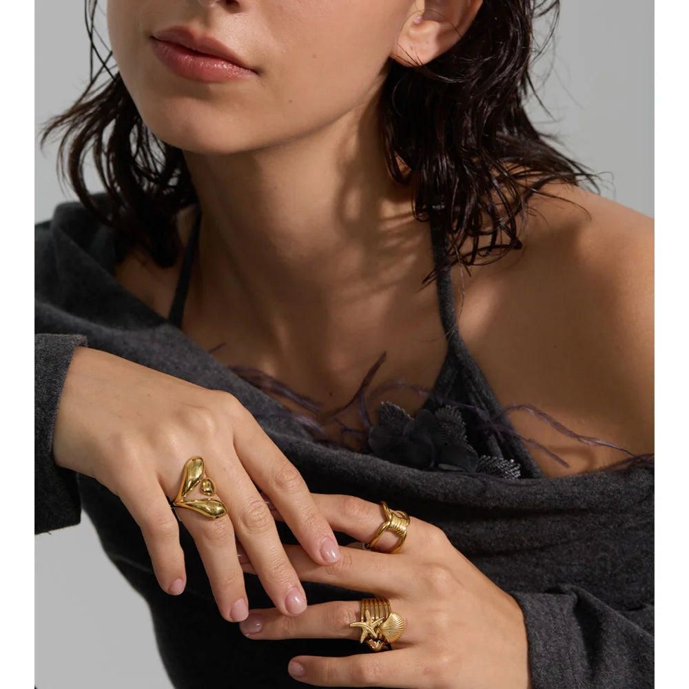 Geometric ring in gold-plated stainless steel.