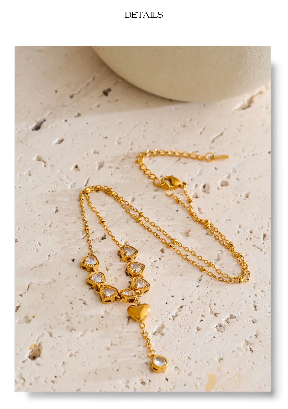 Cubic zirconia heart necklace in gold-plated stainless steel with cubic zirconia.