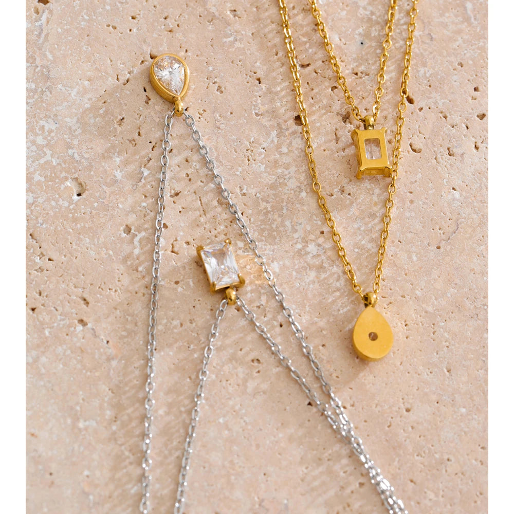 Cubic zirconia geometric layered necklace in gold-plated stainless steel with cubic zirconia.