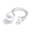 Cubic zirconia pearl geometric ring in 18K gold-plated stainless steel with pearl and cubic zirconia.