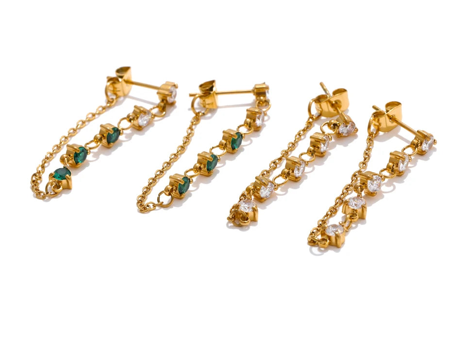 White cubic zirconia geometric earrings in gold-plated stainless steel with cubic zirconia.