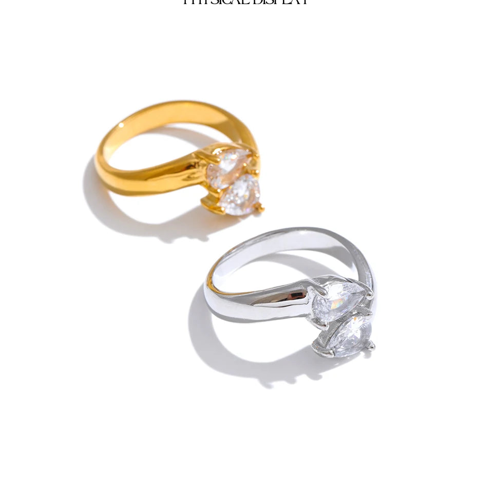 Cubic zirconia geometric ring in 18K gold-plated stainless steel with cubic zirconia.