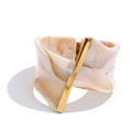 Resin acrylic multi-color bracelet in gold-plated stainless steel with resin and acrylic.