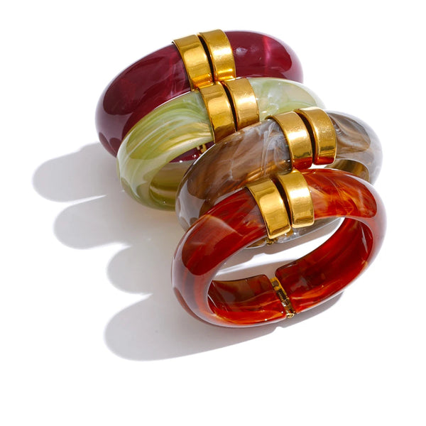 Gold-plated stainless steel bracelet with acrylic in red, green, and brown.