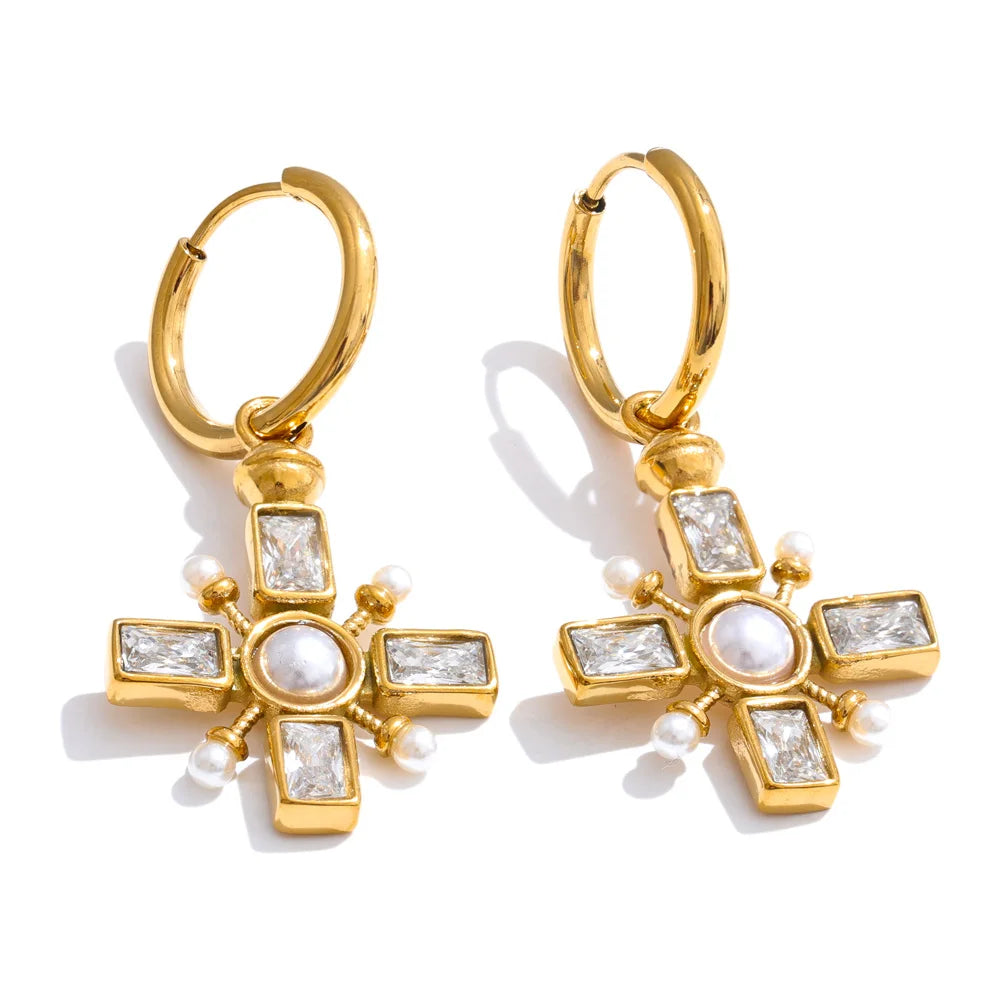 Cubic zirconia pearl cross earrings in gold-plated stainless steel with pearl and cubic zirconia.