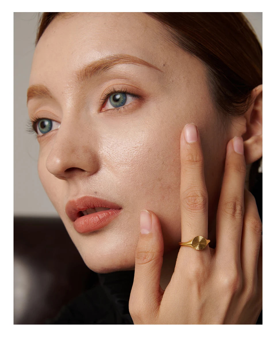 Geometric ring in gold-plated stainless steel.