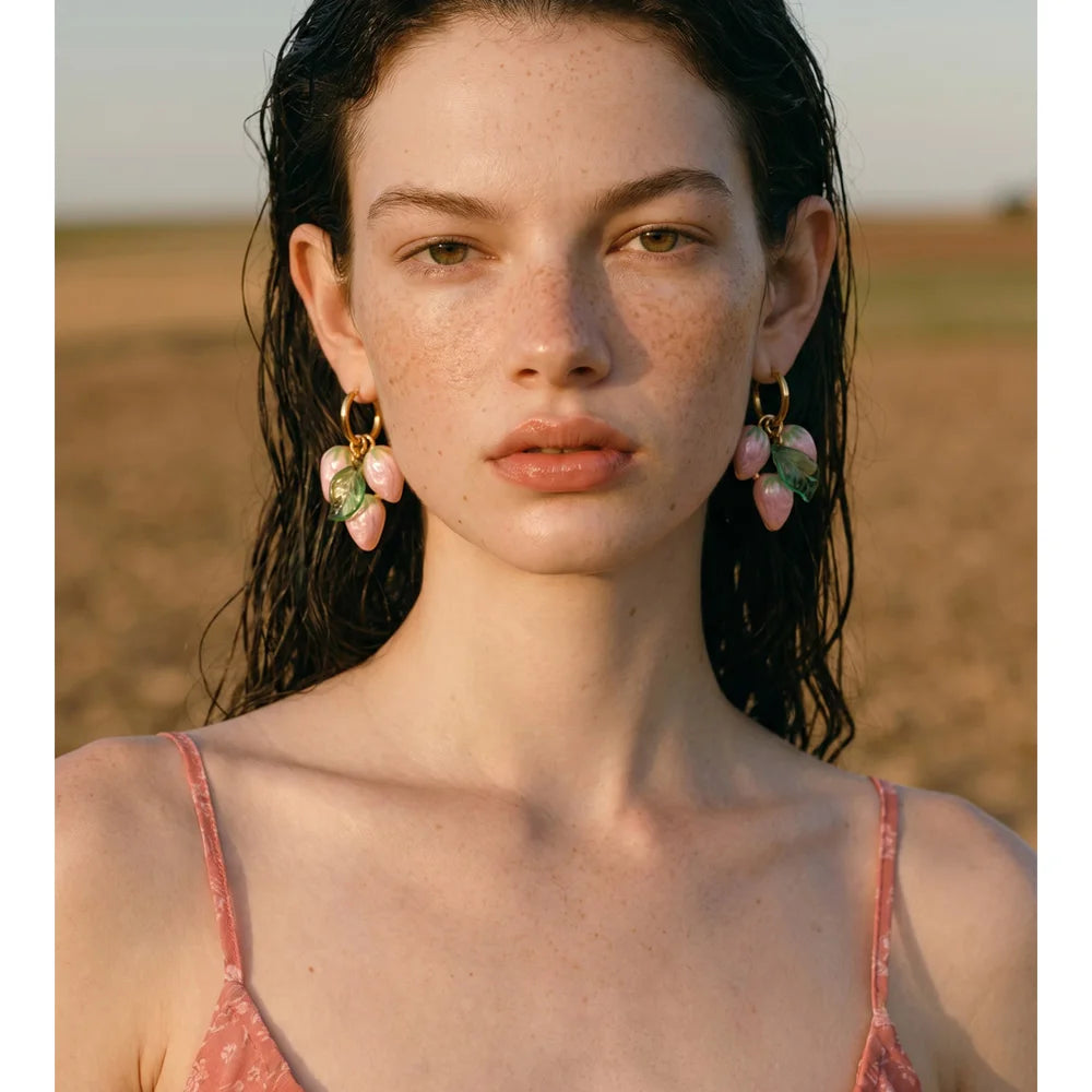 White geometric earrings in gold-plated stainless steel.