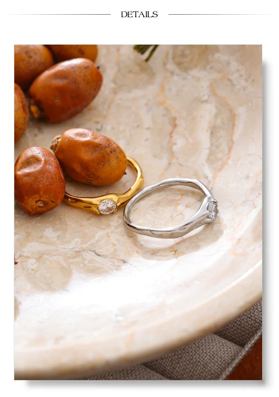 Cubic zirconia geometric ring in 18K gold-plated stainless steel with cubic zirconia.