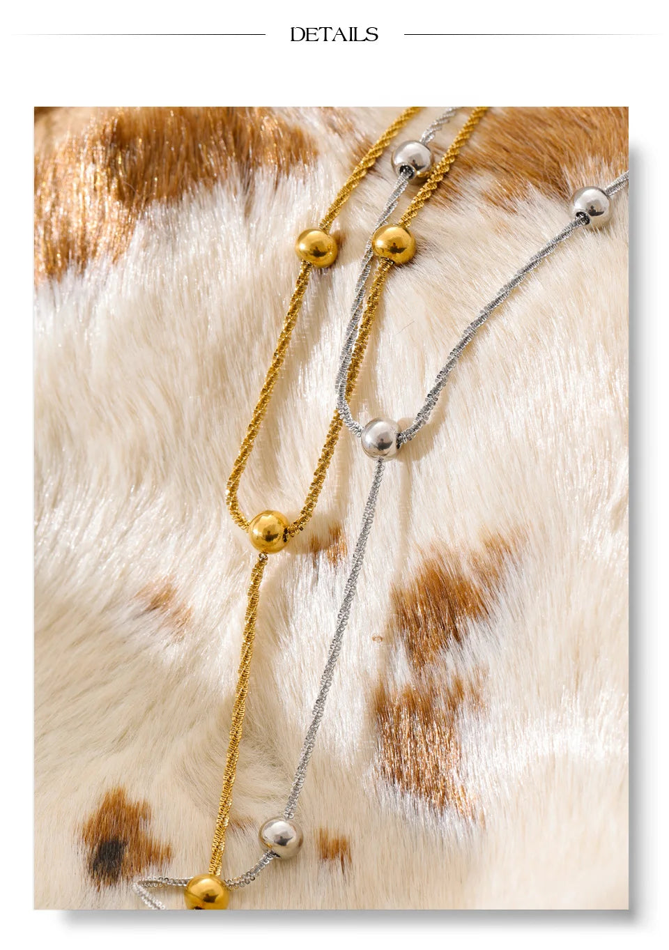 Beaded geometric chain necklace in gold-plated stainless steel.