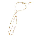 Beaded geometric chain necklace in gold-plated stainless steel.