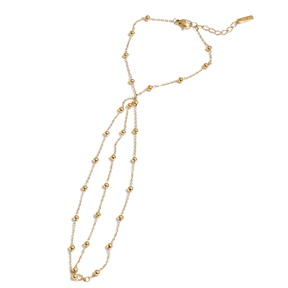Beaded geometric chain necklace in gold-plated stainless steel.