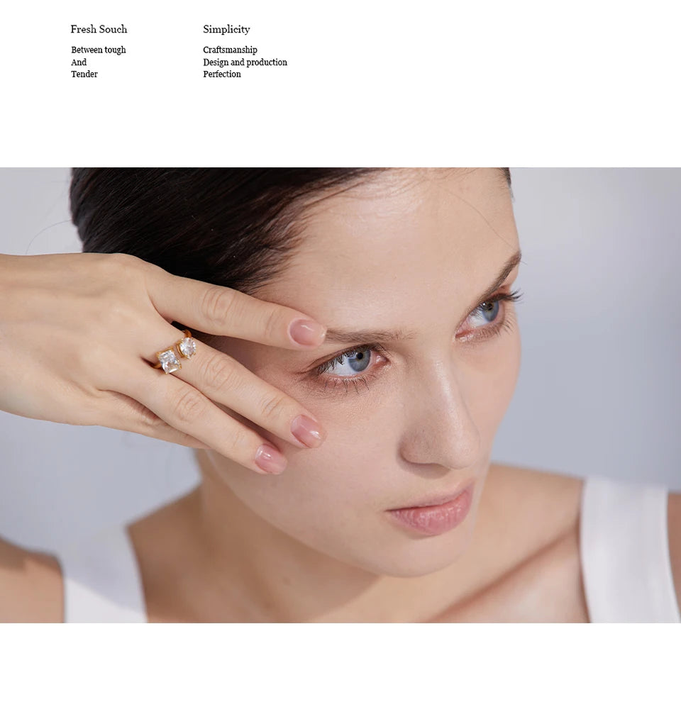 White cubic zirconia geometric ring in 18K gold-plated stainless steel with cubic zirconia.