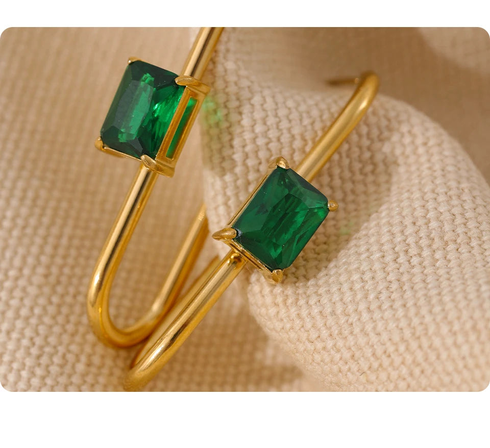 Black cubic zirconia geometric earrings in 18K gold-plated stainless steel with cubic zirconia.