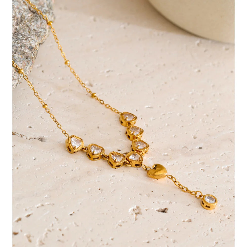 Cubic zirconia heart necklace in gold-plated stainless steel with cubic zirconia.