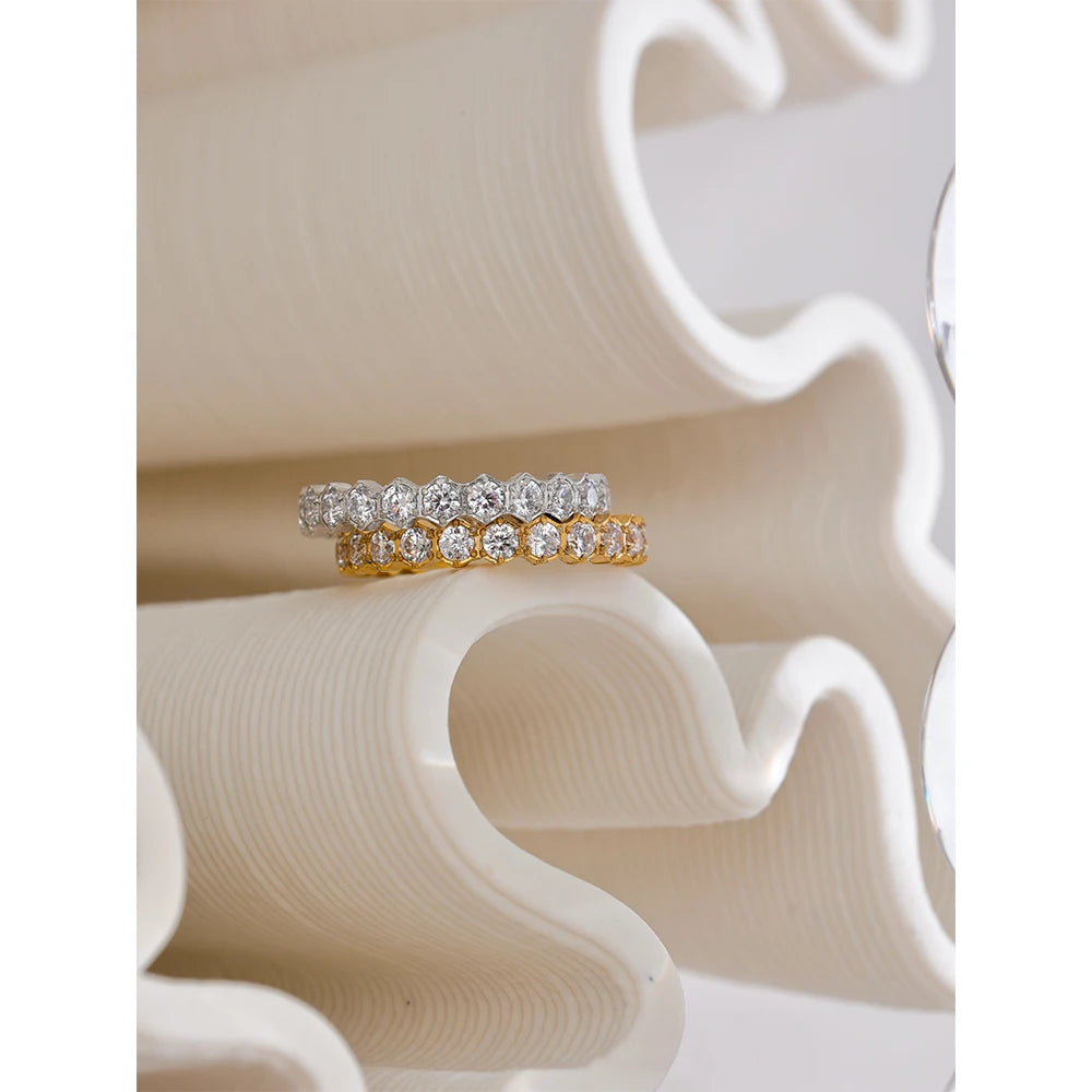 White cubic zirconia geometric ring in gold-plated stainless steel with cubic zirconia.