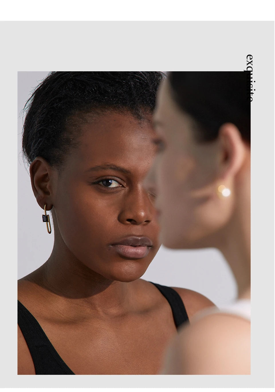Black cubic zirconia geometric earrings in 18K gold-plated stainless steel with cubic zirconia.