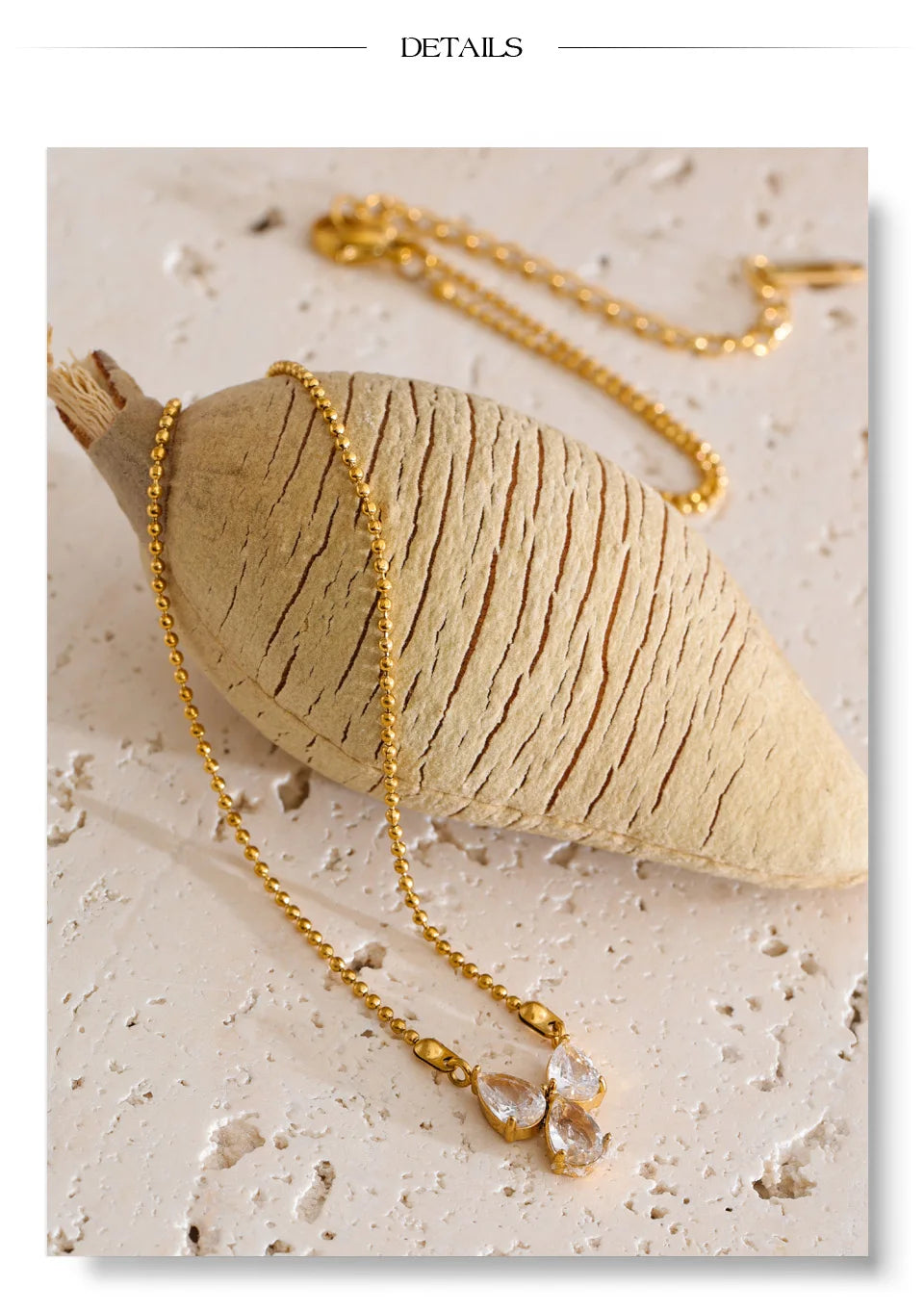 Cubic zirconia geometric necklace in gold-plated stainless steel with cubic zirconia.