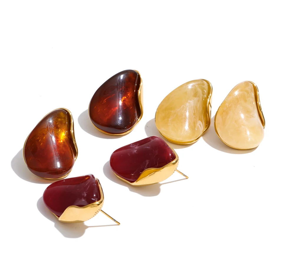 Red resin acrylic earrings in gold-plated stainless steel with resin and acrylic.