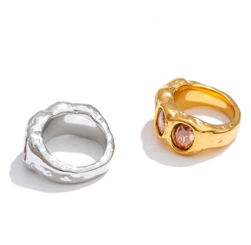 Cubic zirconia geometric ring in 18K gold-plated stainless steel with cubic zirconia.
