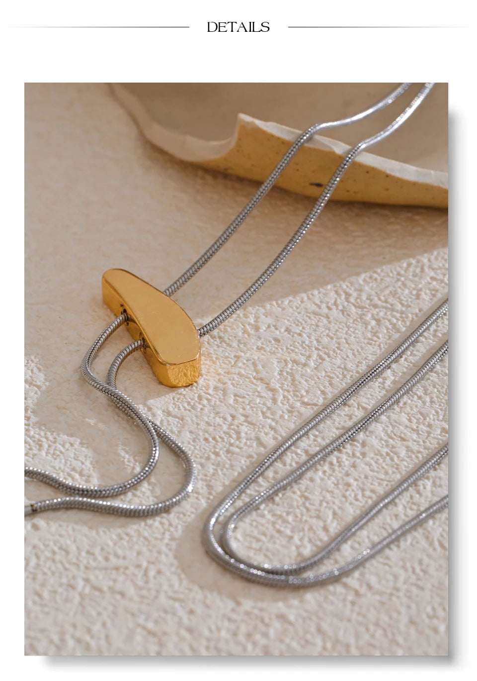Geometric chain necklace in gold-plated 316L stainless steel.