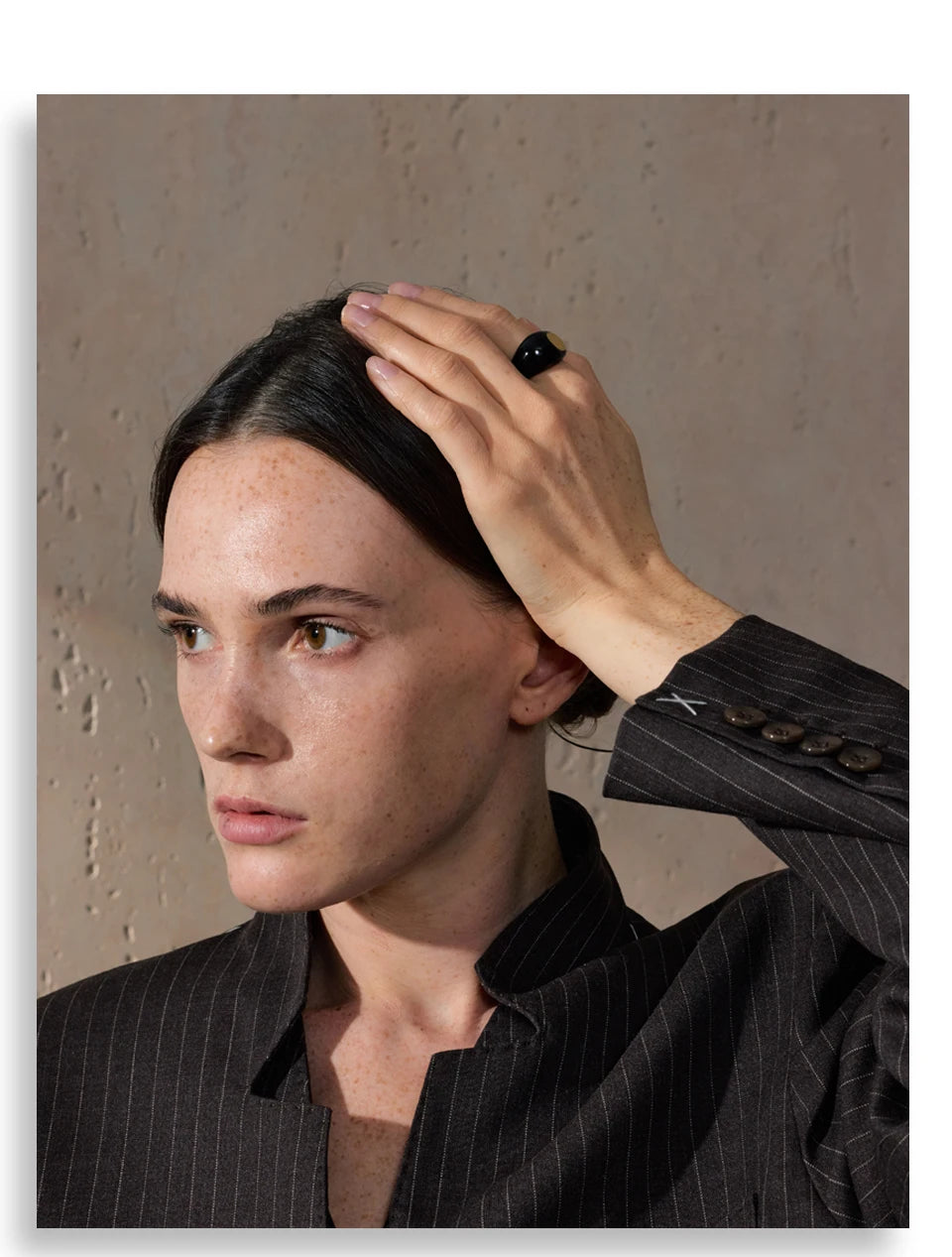 Black enamel geometric ring in gold-plated 316L stainless steel with enamel.