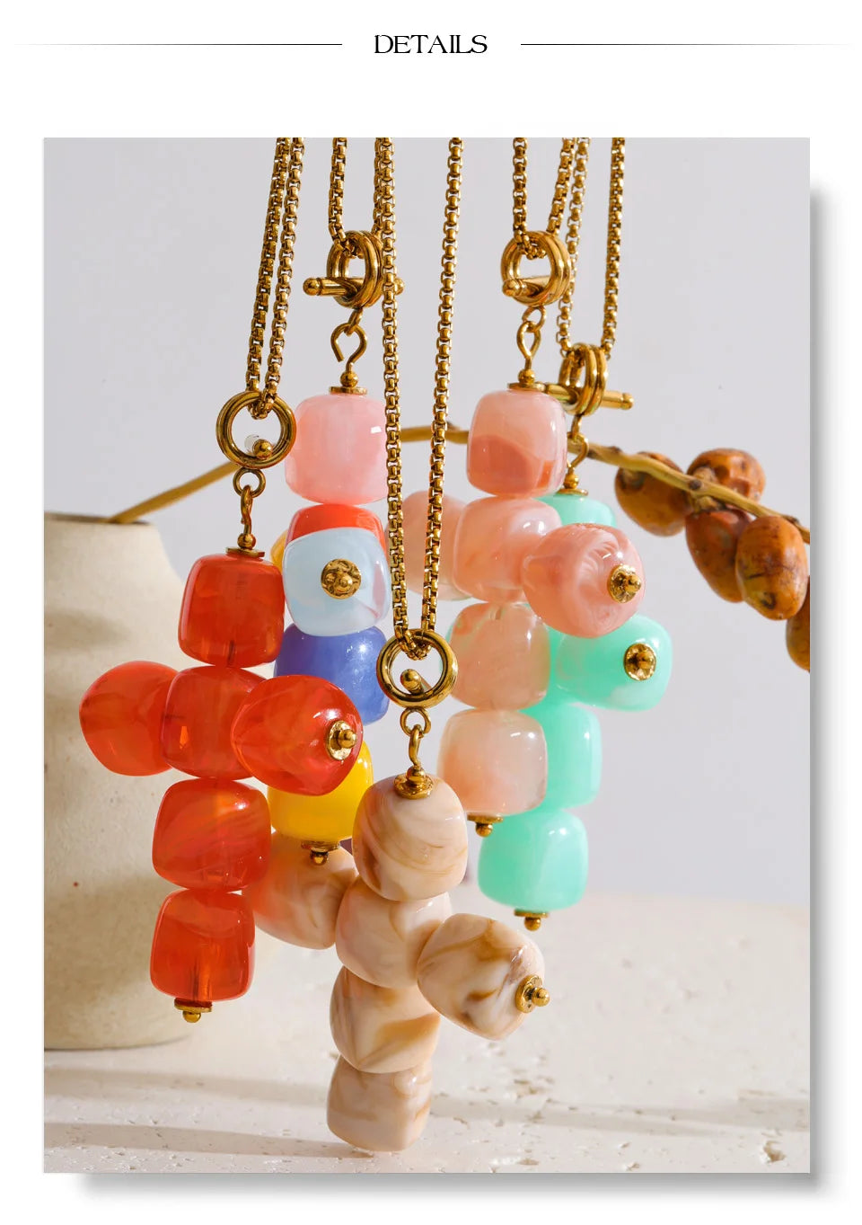 Resin acrylic cross necklace in gold-plated stainless steel with resin and acrylic.