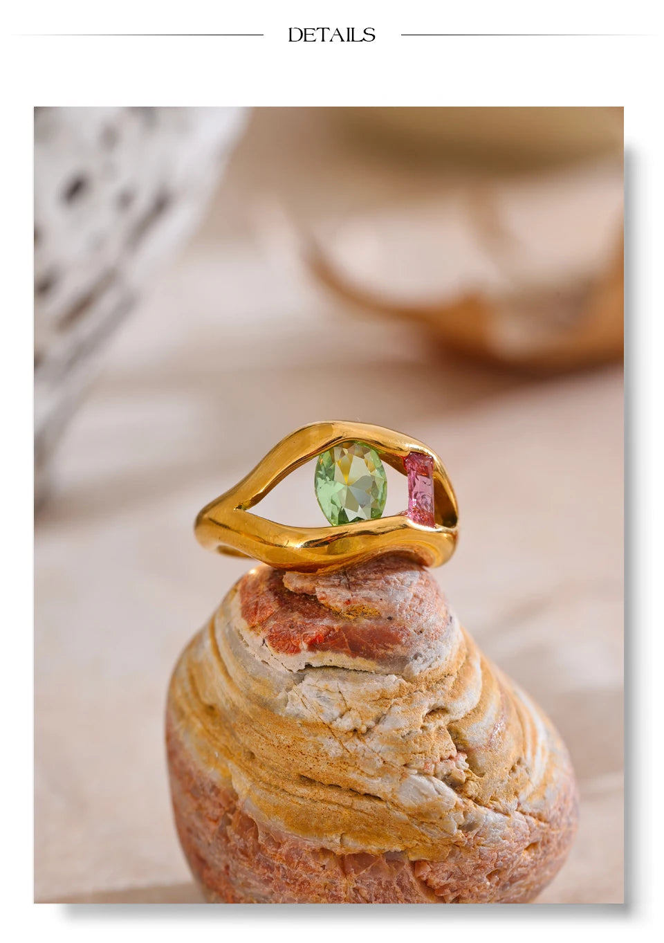 Cubic zirconia geometric ring in 18K gold-plated stainless steel with cubic zirconia.