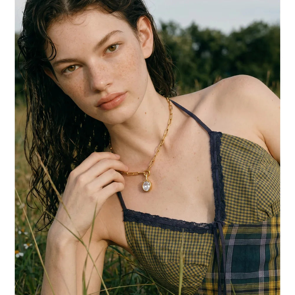 Cubic zirconia geometric necklace in gold-plated stainless steel with cubic zirconia.