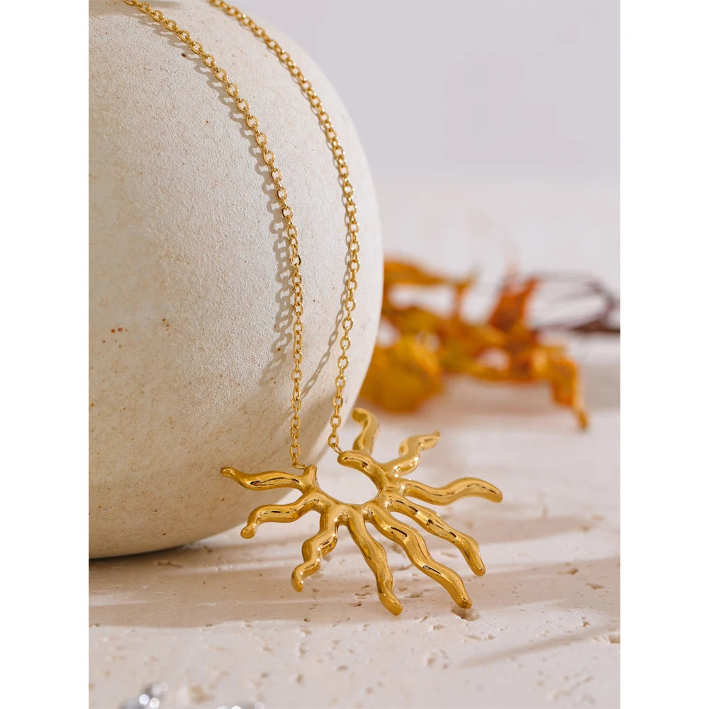 Sun geometric necklace in gold-plated stainless steel.
