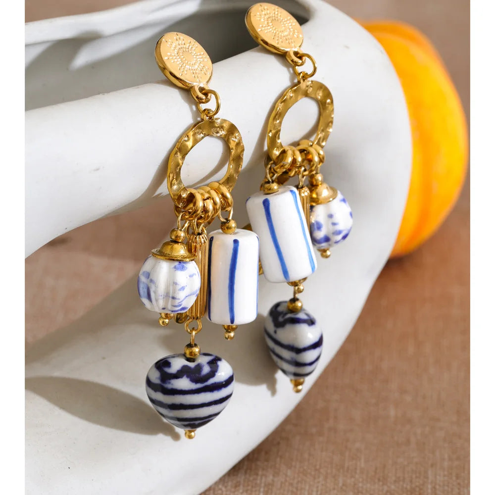 Blue heart flower earrings in gold-plated stainless steel.