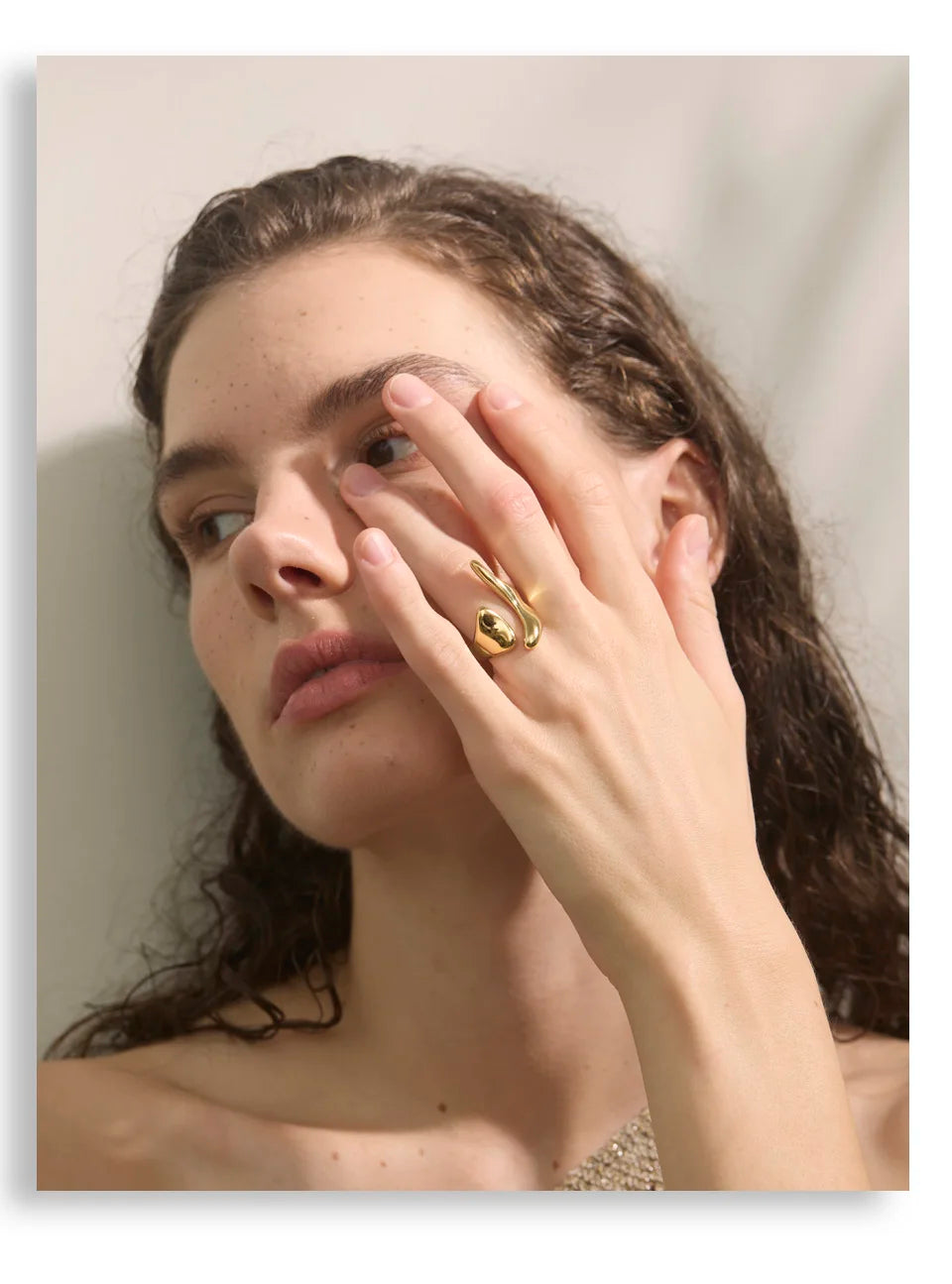 Geometric ring in 18K gold-plated stainless steel.