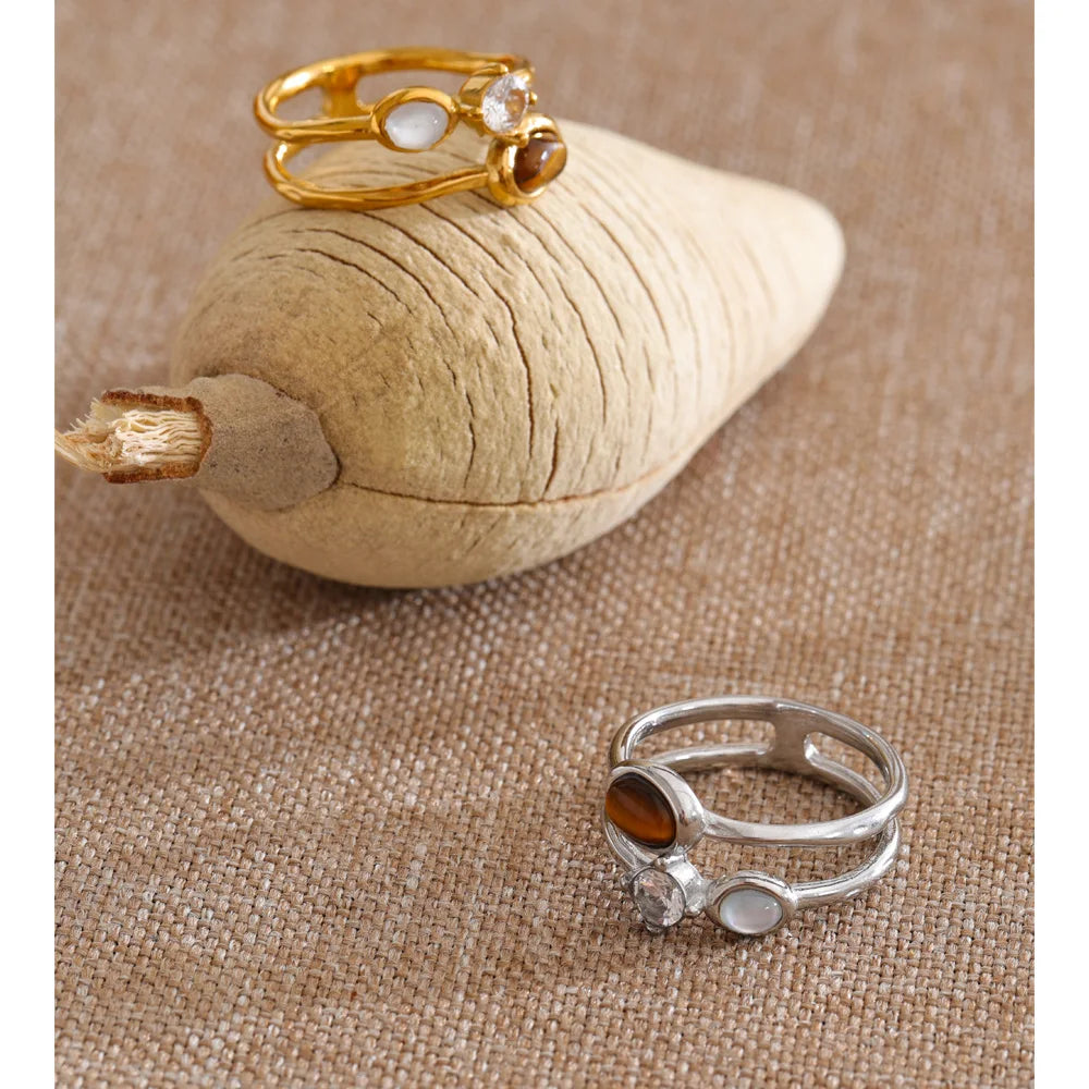 Cubic zirconia natural stone geometric ring in 18K gold-plated stainless steel with cubic zirconia and natural stone.