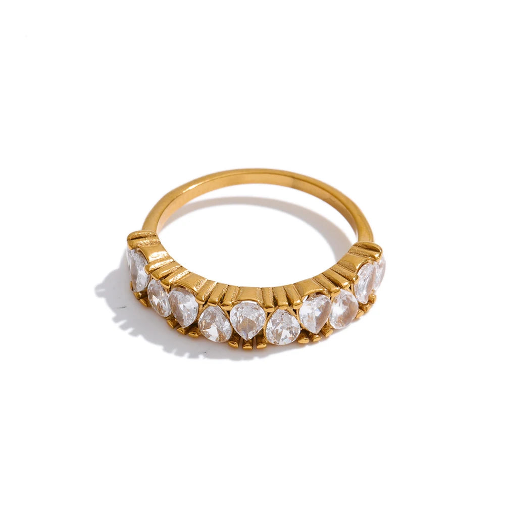 Cubic zirconia geometric ring in 18K gold-plated stainless steel with cubic zirconia.